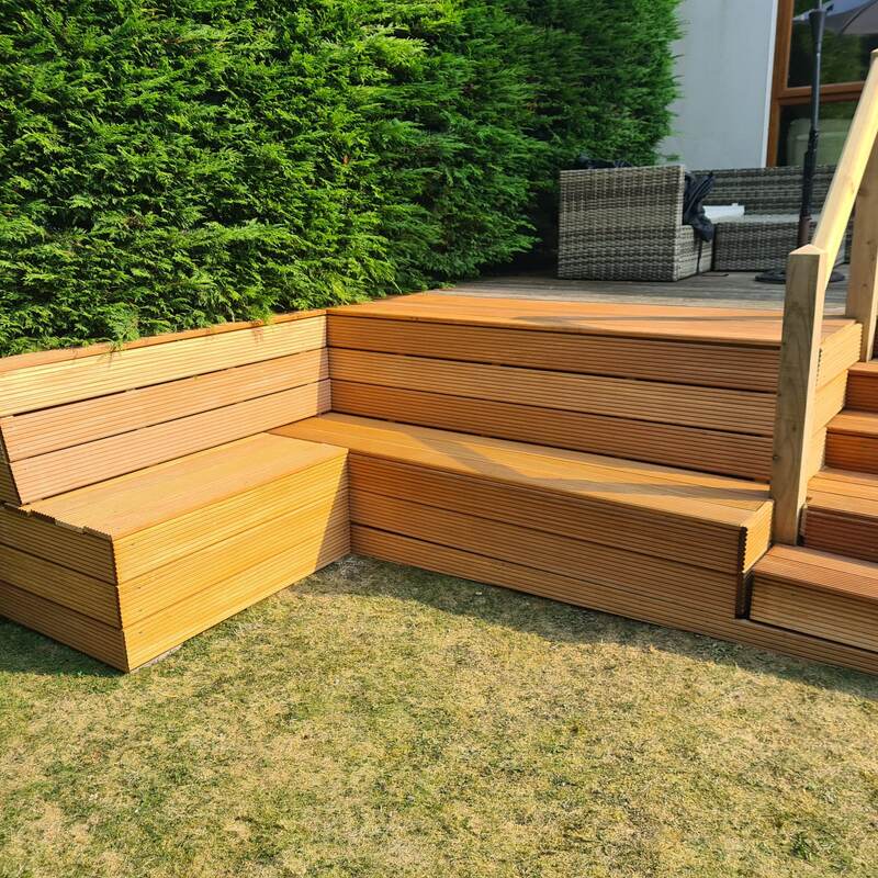 Finished deck steps and bench seating close up