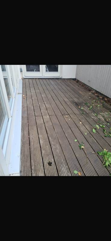 Worn, weathered balcony decking before restoration