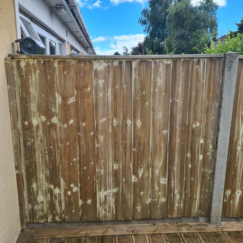 Weathered, stripped-back timber fence panel before restoration