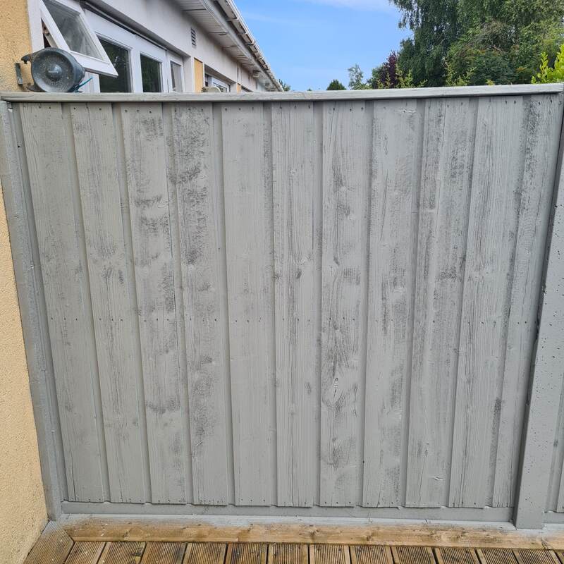 Same fence panel repainted grey and restored