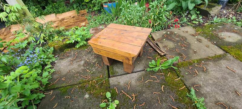 Small solid timber garden stool or side table