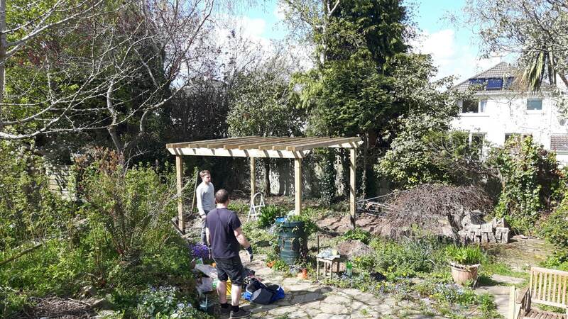 Pergola frame going up, posts and beams in place