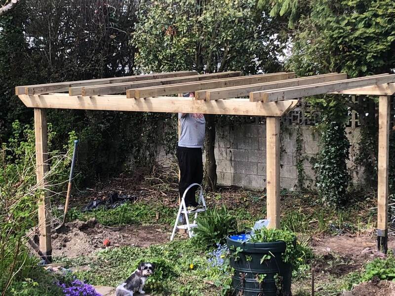 Rafters being fitted to the pergola frame