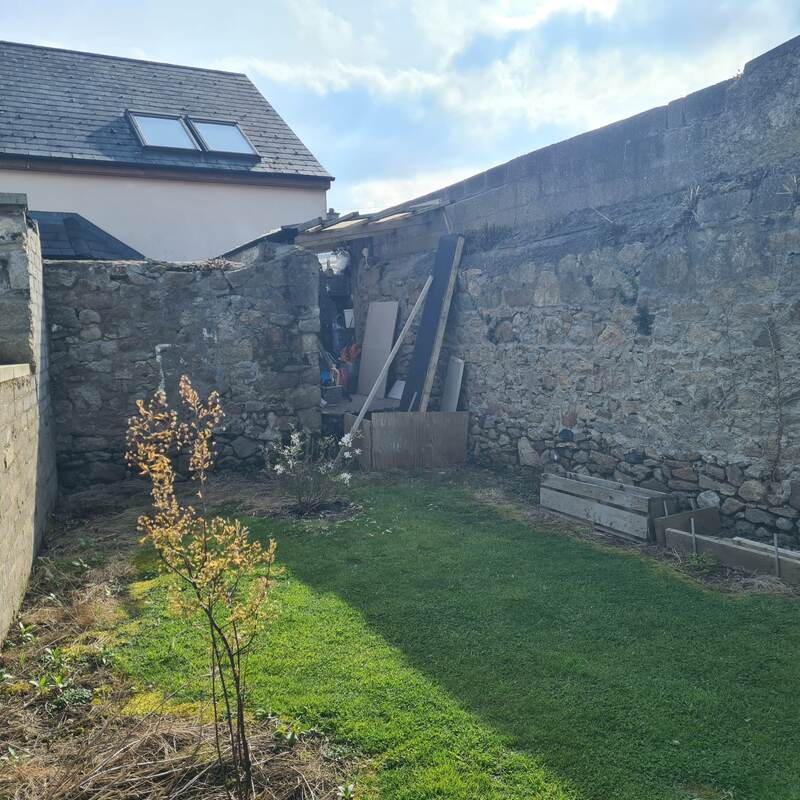 Bare garden corner before work began