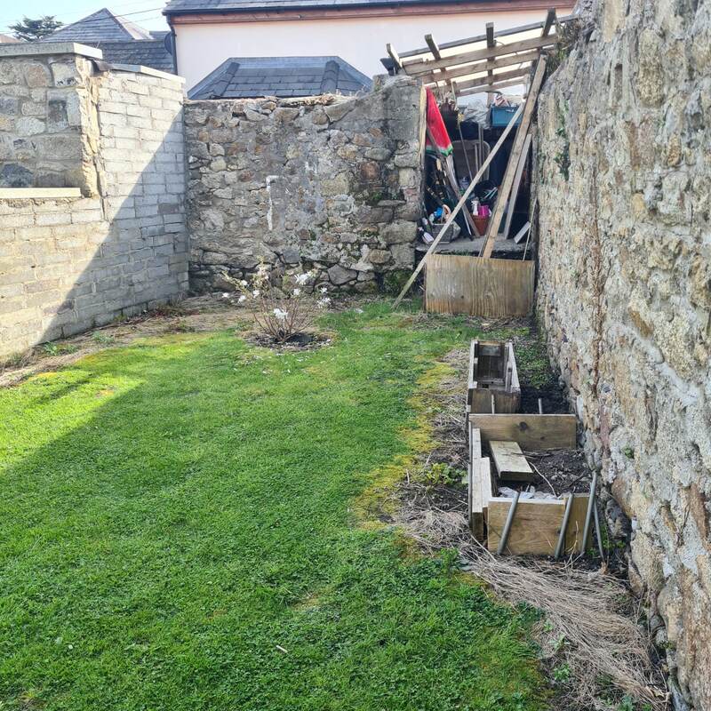 Cleared garden corner ready for the raised beds