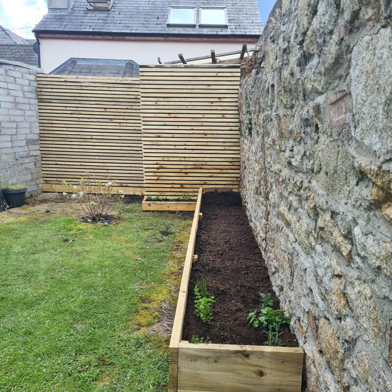 Raised bed extended and freshly planted
